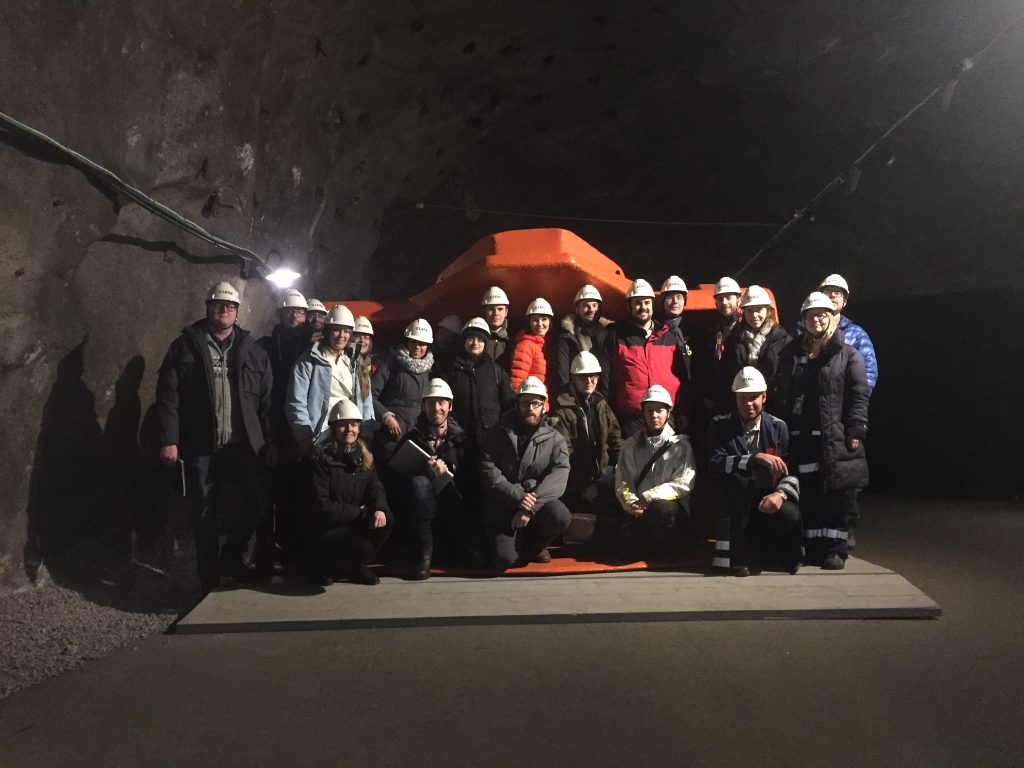 image of students in a cave